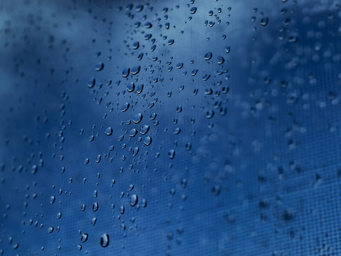 Close-up of laminated hurricane impact glass in a window frame